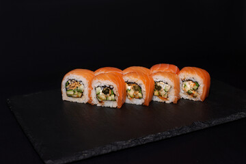 sushi hot rolls on black background dish japanese cuisine