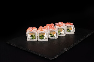 sushi hot rolls on black background dish japanese cuisine
