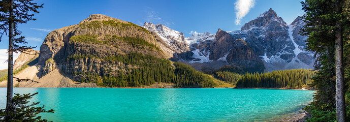 Moraine lake beautiful landscape in summer to early autumn sunny day morning. Sparkle turquoise...