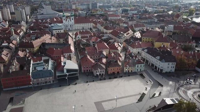 Aerial / drone footage of the Dunakapu Square in downtown Győr, capital of Győr-Moson-Sopron County, Western Transdanubia region in Norhwestern Hungary