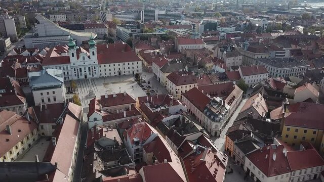 Aerial / drone footage of Szechenyi Square in downtown Győr, capital of Győr-Moson-Sopron County, Western Transdanubia region in Norhwestern Hungary