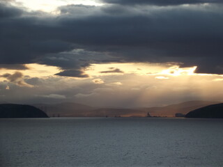 dark clouds and sundown at murray firth in scotland