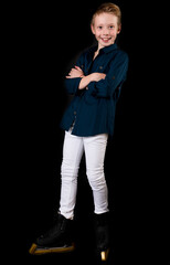Young figure skater dressed in white jeans and blue shirt