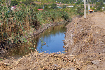 Drainage channel for rainwater on the outskirts of the city
