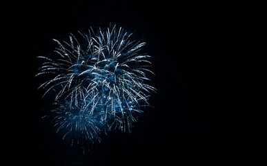 blue fireworks in the night christmas sky