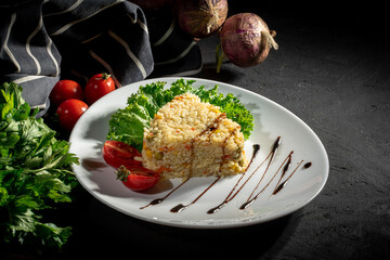 Fried rice with chicken. Delicious risotto with chicken and green peas on dark background