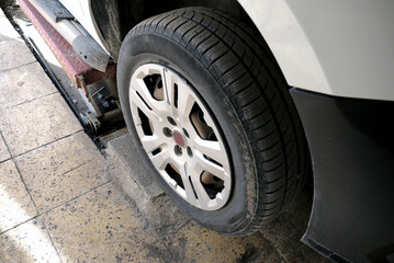 fitting winter tires on a car, tire mechanic,