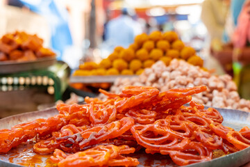 Fresh Jalebi Sweet Snack outdoors in a bazaar.