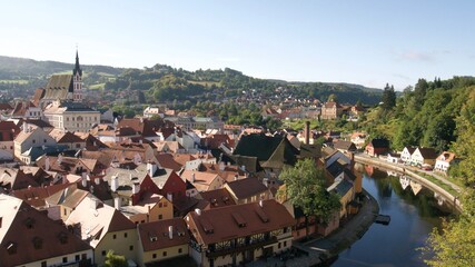 Fototapeta na wymiar Famous old Czech town with red roofs and a castle on a summer day 