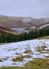 dam under a hill covered in a little snow, Glendevon, Scotland