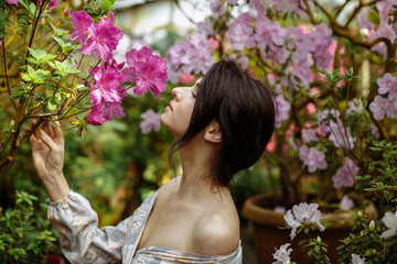 Fototapeta premium a girl in a long dress in a big garden