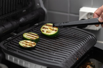 Grilled vegetables. Zucchini. Vegetarian food. Cooking process. Close-up. 