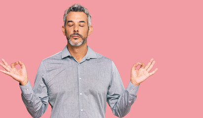 Middle age grey-haired man wearing casual clothes relax and smiling with eyes closed doing meditation gesture with fingers. yoga concept.