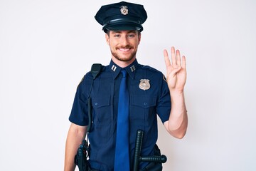 Young caucasian man wearing police uniform showing and pointing up with fingers number four while smiling confident and happy.