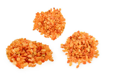 Golden raisins isolated on white background.