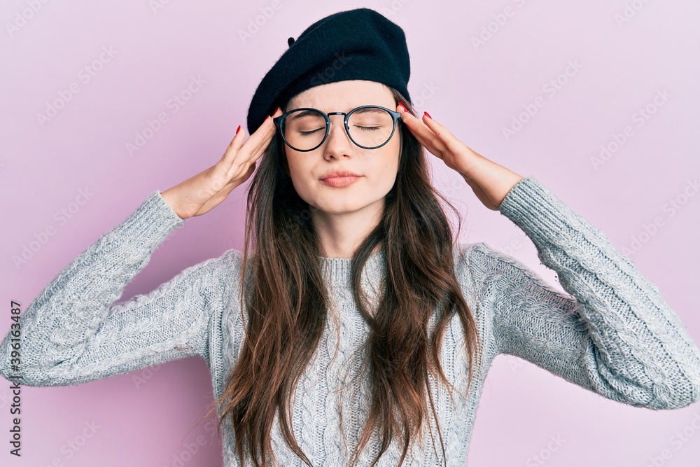 Sticker young beautiful caucasian girl wearing french look with beret with hand on head, headache because st