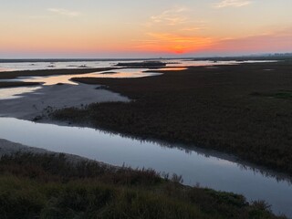 Rye Harbour, Nature reserve, East Sussex UK - 28.11.2020: Rye Harbour landscape view at low tide harbour wetlands popular with bird watchers at sunset