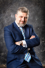 Mature businessman in a suit studio portrait.