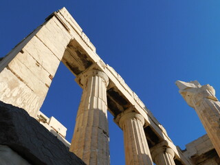 View of the columns of the monumental gateway to the ancient Acropolis of Athens, or Propylaea, in...
