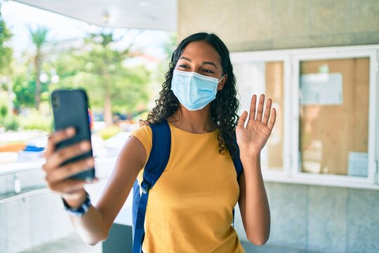Young african american student girl smiling happy walking at university campus.