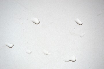 Water droplets run down the glass