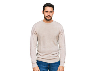 Young hispanic man wearing casual clothes skeptic and nervous, frowning upset because of problem. negative person.