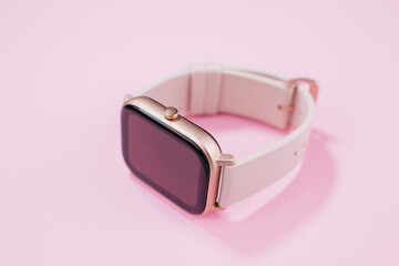 a women smart watch on pink background