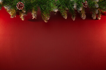 Christmas garland on a red wall background