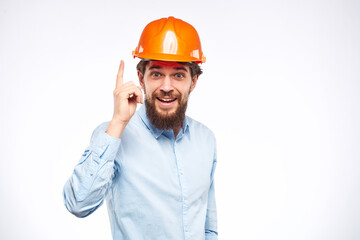 Engineers shirt orange hard hat construction lifestyle emotions cropped view light background