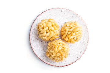 Traditional Tatar candy chak-chak made of dough and honey isolated on white background. top view.