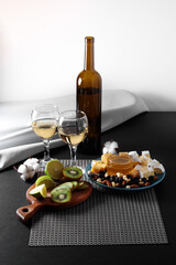 Dinner for two with white wine, cheese, honey and fruit