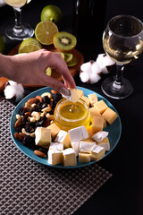 Dinner for two with white wine, cheese, honey and fruit