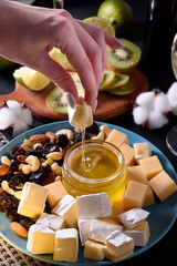 Dinner for two with white wine, cheese, honey and fruit