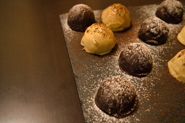 Dark and white chocolate bonbons filled with raspberry and coconut