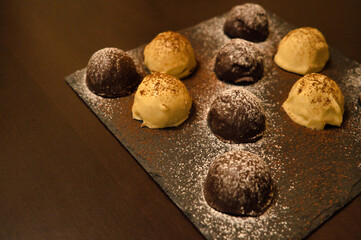 Dark and white chocolate bonbons filled with raspberry and coconut