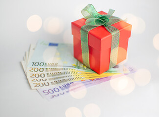 red giftbox with euro banknotes