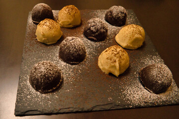 Dark and white chocolate bonbons filled with raspberry and coconut