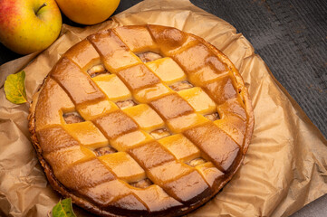 Fresh baked apple cake or pie, filled with sweet apples, raisins and cinnamon