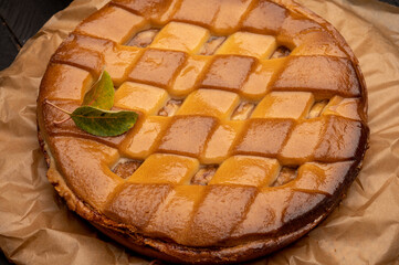 Fresh baked apple cake or pie, filled with sweet apples, raisins and cinnamon