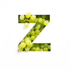 Letter Z of English alphabet of fresh grape and cut paper isolated on white. Typeface for design made of green berries