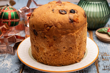 Christmas food, fresh Italian panettone cake made from yeast dough with dried fruits