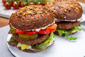 Grilled plant based, meat free vega burgers close up