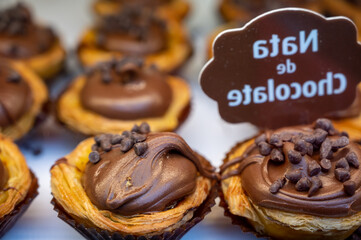 Traditional dessert pastry in Portugal, nata eggs cream cakes with chocolate