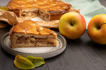 Fresh baked apple cake or pie, filled with sweet apples, raisins and cinnamon