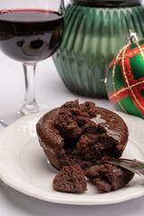 Popular british christmas food, glass of vintage ruby port wine and hot chocolate cake with christmas tree decoration on background