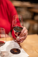 Professional tasting of different fortified dessert ruby, tawny port wines in glasses in porto cellars in Vila Nova de Gaia, Portugal