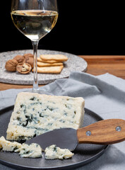 Cheese and wine pairing, french soft blue roquefort cheese and sweet white sauternes wine from Bordeaux, France