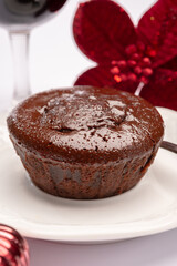 Popular british christmas food, glass of vintage ruby port wine and hot chocolate cake with christmas tree decoration on background