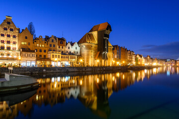 Famous old port crane of Gdansk and Motlawa River at night. Poland, Europe.