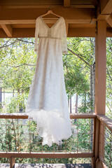Vintage Beaded Wedding Dress Hanging Outdoors